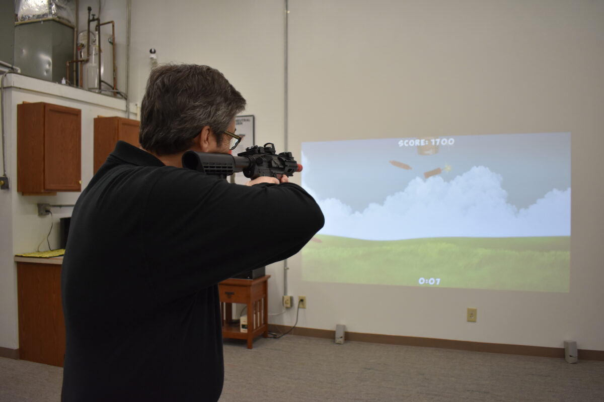 Man Training with Virtual Gun Range